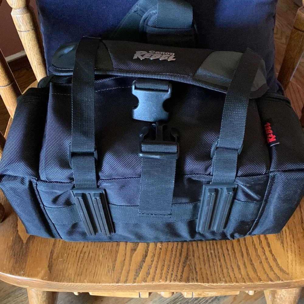 Canon camera bag with many pockets, zippers, straps, 5 inside compartments. EUC